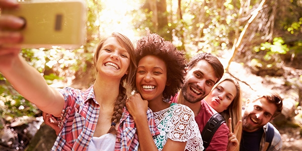 A group of Millennials takes a selfie